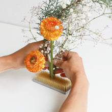 Load image into Gallery viewer, hands arranging flowers arrnaged on the rectangle kenzan