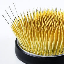 Load image into Gallery viewer, Arrow showing the wide spread direction of the needle on the kenzan
